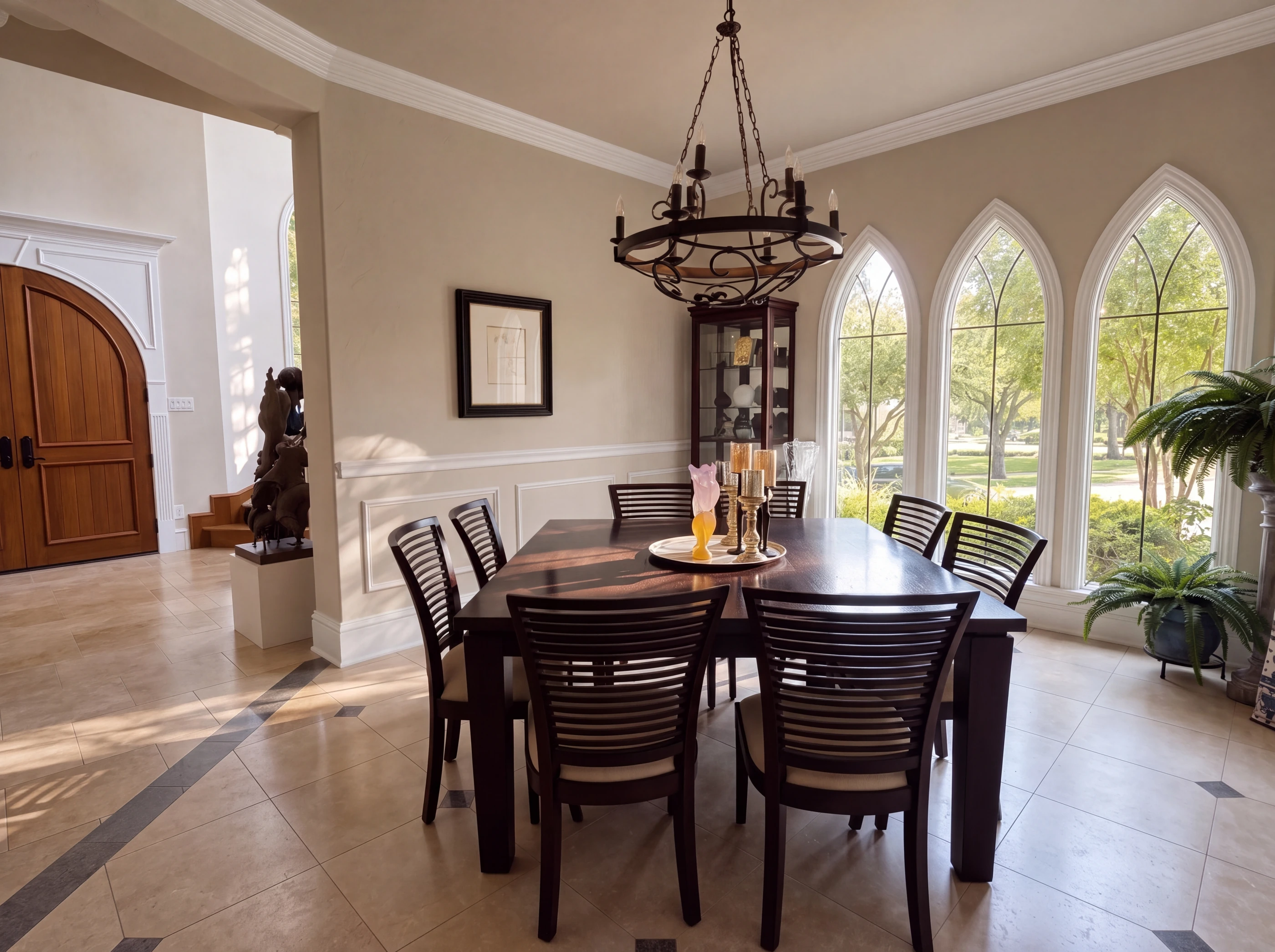 Formal dining room with arched windows
